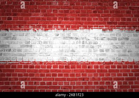 An image of the Austria flag painted on a brick wall in an urban location Stock Photo