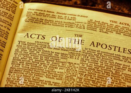 Close up of antique Holy Bible page, shallow depth of field with focus on chapter title heading, Acts of the Apostles Stock Photo