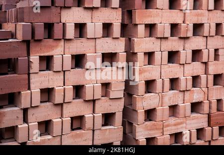 Red brick on pallets in brick factory Stock Photo