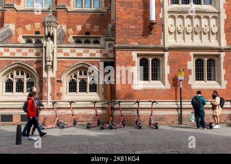An external view of the Old Divinity School on St Johns Street, Cambridge, UK with Voi rental electric scooters parked outside. Stock Photo