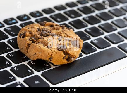 Chocolate on keyboard symbol of internet cookies Stock Photo