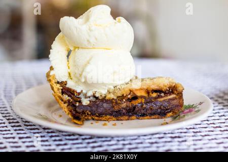 A slice of apple pie topped with vanilla ice cream in Cebu, Philippines Stock Photo