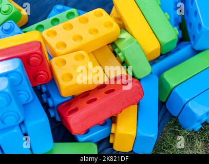 Many of huge colorful toy bricks for kids in heap Stock Photo