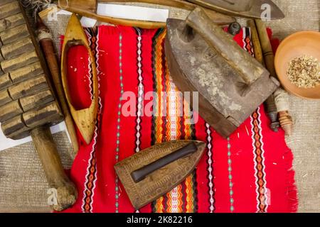 Old iron. Close-up of old rusty irons. Antique linen ironing tools . selective focus Stock Photo