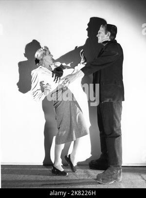 Ilona Massey & Bela Lugosi Film: Frankenstein Meets The Wolf Man (USA 1943) Characters: Baroness Elsa Frankenstein, Monster  Director: Roy William Neill 05 March 1943   **WARNING** This Photograph is for editorial use only and is the copyright of UNIVERSAL and/or the Photographer assigned by the Film or Production Company and can only be reproduced by publications in conjunction with the promotion of the above Film. A Mandatory Credit To UNIVERSAL is required. The Photographer should also be credited when known. No commercial use can be granted without written authority from the Film Company. Stock Photo