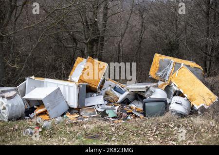 Abandoned disposed electronic waste, household equipment in nature Stock Photo