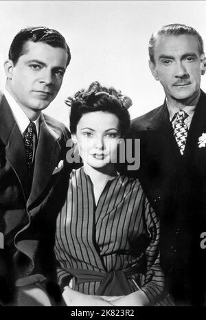 Dana Andrews, Gene Tierney & Clifton Webb Film: Laura (USA 1944) Characters: Det. Lt. Mark McPherson, Laura Hunt, Waldo Lydecker  / Literaturverfilmung (Based On The Book By Vera Caspary) Director: Otto Preminger 11 October 1944   **WARNING** This Photograph is for editorial use only and is the copyright of 20TH CENTURY FOX and/or the Photographer assigned by the Film or Production Company and can only be reproduced by publications in conjunction with the promotion of the above Film. A Mandatory Credit To 20TH CENTURY FOX is required. The Photographer should also be credited when known. No com Stock Photo