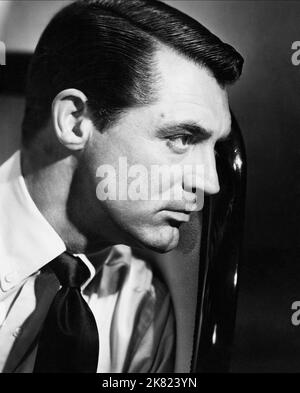 Cary Grant Film: Notorious (USA 1964) Characters: T.R. Devlin  Director: Alfred Hitchcock 15 August 1946   **WARNING** This Photograph is for editorial use only and is the copyright of RKO and/or the Photographer assigned by the Film or Production Company and can only be reproduced by publications in conjunction with the promotion of the above Film. A Mandatory Credit To RKO is required. The Photographer should also be credited when known. No commercial use can be granted without written authority from the Film Company. Stock Photo