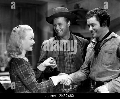 Jane Wyman, Wayne Morris & Dennis Morgan Film: Bad Men Of Missouri (1941) Characters: Mary Hathaway, Bob Younger, Cole Younger  Director: Ray Enright 26 July 1941   **WARNING** This Photograph is for editorial use only and is the copyright of WARNER and/or the Photographer assigned by the Film or Production Company and can only be reproduced by publications in conjunction with the promotion of the above Film. A Mandatory Credit To WARNER is required. The Photographer should also be credited when known. No commercial use can be granted without written authority from the Film Company. Stock Photo