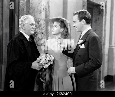 Frank Morgan, Jean Rogers & Richard Carlson Film: A Stranger In Town (1943) Characters: John Josephus Grant, Lucy Gilbert, Bill Adams  Director: Roy Rowland 01 April 1943   **WARNING** This Photograph is for editorial use only and is the copyright of METRO and/or the Photographer assigned by the Film or Production Company and can only be reproduced by publications in conjunction with the promotion of the above Film. A Mandatory Credit To METRO is required. The Photographer should also be credited when known. No commercial use can be granted without written authority from the Film Company. Stock Photo