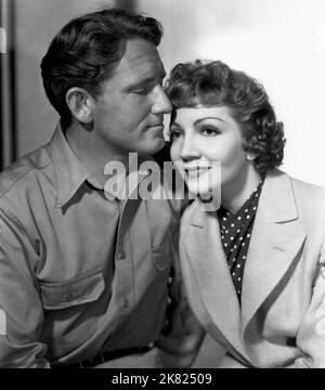 Spencer Tracy & Claudette Colbert Film: Boom Town (USA 1940) Characters: Jonathan Sand, Elizabeth Bartlett McMasters  Director: Jack Conway 30 August 1940   **WARNING** This Photograph is for editorial use only and is the copyright of MGM and/or the Photographer assigned by the Film or Production Company and can only be reproduced by publications in conjunction with the promotion of the above Film. A Mandatory Credit To MGM is required. The Photographer should also be credited when known. No commercial use can be granted without written authority from the Film Company. Stock Photo