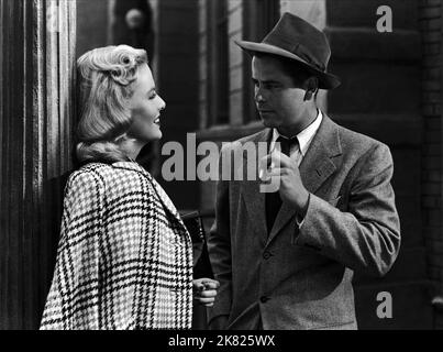 GLENN FORD and JANIS CARTER in FRAMED (1947), directed by RICHARD ...