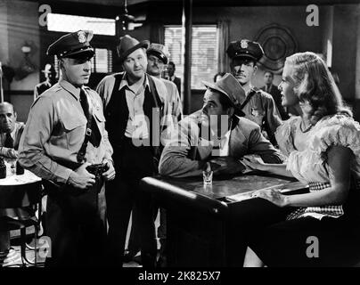 GLENN FORD and JANIS CARTER in FRAMED (1947), directed by RICHARD ...