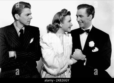 Ronald Reagan, Priscilla Lane, Jeffrey Lynn Film: Million Dollar Baby (USA 1941) Characters: Peter 'Pete' Rowan,Pamela 'Pam' McAllister,James 'Jim' / 'Jimmy' Amory  Director: Curtis Bernhardt 31 May 1941   **WARNING** This Photograph is for editorial use only and is the copyright of WARNER BROS. and/or the Photographer assigned by the Film or Production Company and can only be reproduced by publications in conjunction with the promotion of the above Film. A Mandatory Credit To WARNER BROS. is required. The Photographer should also be credited when known. No commercial use can be granted withou Stock Photo