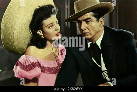 Linda Darnell & Victor Mature Film: My Darling Clementine (USA 1946) Characters: Chihuahua & Dr. John 'Doc' Holliday  / Titel Auch: 'Tombstone' / Literaturverfilmung (Based On The Book By  Stuart N. Lake) Director: John Ford 16 October 1946   **WARNING** This Photograph is for editorial use only and is the copyright of 20TH CENTURY FOX and/or the Photographer assigned by the Film or Production Company and can only be reproduced by publications in conjunction with the promotion of the above Film. A Mandatory Credit To 20TH CENTURY FOX is required. The Photographer should also be credited when k Stock Photo