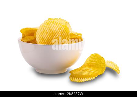 View of dry crispy fried corrugated potato chips in white ceramic bowl isolated on white background with clipping path. Stock Photo