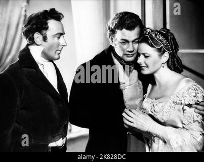 Michael Wilding, Joseph Cotten & Ingrid Bergman Film: Under Capricorn (1949) Characters: Hon. Charles Adare, Sam Flusky, Lady Henrietta Flusky  Director: Alfred Hitchcock 08 September 1949   **WARNING** This Photograph is for editorial use only and is the copyright of WARNER BROS and/or the Photographer assigned by the Film or Production Company and can only be reproduced by publications in conjunction with the promotion of the above Film. A Mandatory Credit To WARNER BROS is required. The Photographer should also be credited when known. No commercial use can be granted without written authori Stock Photo