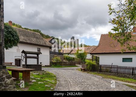 Holloko, Hungary - 3 October, 2022: view of the historic village center of Holloko with the 14th-century castle in the background Stock Photo