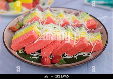 Rainbow Swirl Cake. Square rainbow cake on a plate Stock Photo