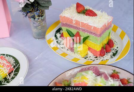Rainbow Swirl Cake. Square rainbow cake on a plate Stock Photo