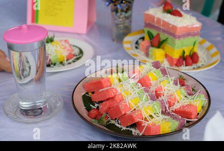 Rainbow Swirl Cake. Square rainbow cake on a plate Stock Photo
