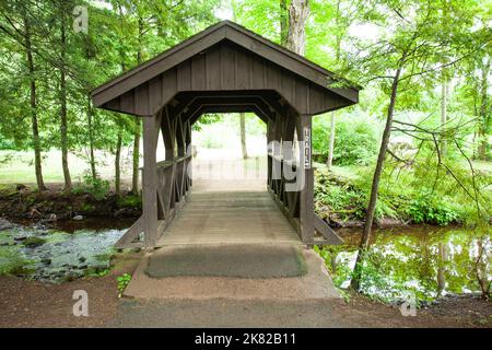 Covered Footbridge in a park  Stock Photo