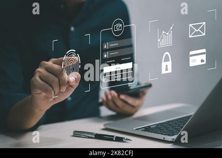computer cyber security internet networking and information personal protect business transaction from online digital.Businessman using fingerprint sc Stock Photo