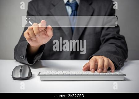 man hand searching browsing for information internet data Technology on computer keyboard notebook.SEO Search Engine Optimization. Stock Photo