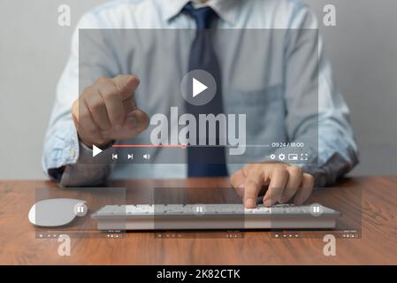 Businessman hands using mouse and keyboard computer for streaming online on virtual screen, watching video on internet. Stock Photo