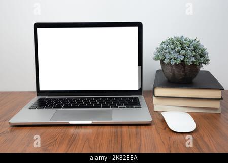 Mockup computer laptop display blank screen on desk in office. Stock Photo