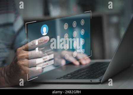 man using laptop computer and sign up or log in username password virtual touch screen. Stock Photo