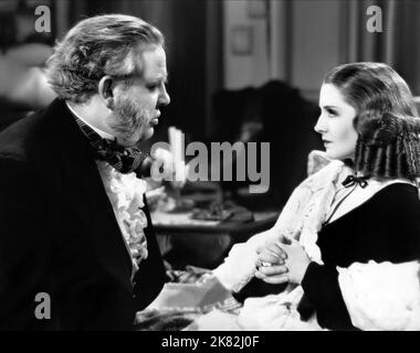 Charles Laughton & Norma Shearer Film: The Barretts Of Wimpole Street (1935) Characters: Edward Moulton-Barrett, Elizabeth Barrett  Director: Sidney Franklin 14 September 1934   **WARNING** This Photograph is for editorial use only and is the copyright of MGM and/or the Photographer assigned by the Film or Production Company and can only be reproduced by publications in conjunction with the promotion of the above Film. A Mandatory Credit To MGM is required. The Photographer should also be credited when known. No commercial use can be granted without written authority from the Film Company. Stock Photo