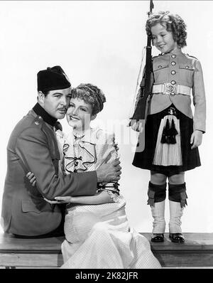 Michael Whalen, June Lang & Shirley Temple Film: Wee Willie Winkie (1939) Characters: Lt. 'Coppy' Brandes, Joyce Williams, Priscilla 'Winkie' Williams  Director: John Ford 30 July 1937   **WARNING** This Photograph is for editorial use only and is the copyright of 20TH CENTURY FOX and/or the Photographer assigned by the Film or Production Company and can only be reproduced by publications in conjunction with the promotion of the above Film. A Mandatory Credit To 20TH CENTURY FOX is required. The Photographer should also be credited when known. No commercial use can be granted without written a Stock Photo