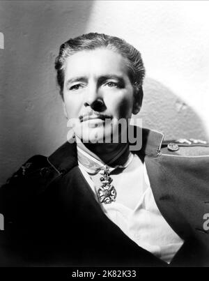 Ronald Colman Film: The Prisoner Of Zenda (USA 1937) Characters: Major Rudolf Rassendyll  Director: John Cromwell 02 September 1937   **WARNING** This Photograph is for editorial use only and is the copyright of UNITED ARTISTS and/or the Photographer assigned by the Film or Production Company and can only be reproduced by publications in conjunction with the promotion of the above Film. A Mandatory Credit To UNITED ARTISTS is required. The Photographer should also be credited when known. No commercial use can be granted without written authority from the Film Company. Stock Photo