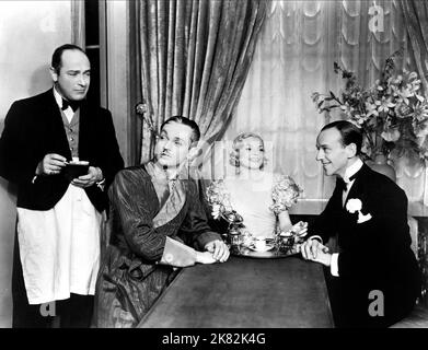 Eric Blore, Edward Everett Horton, Ginger Rogers & Fred Astaire Film: The Gay Divorcee (1934) Characters: The waiter, Egbert 'Pinky' Fitzgerald, Mimi Glossop, Guy Holden  Director: Mark Sandrich 12 October 1934   **WARNING** This Photograph is for editorial use only and is the copyright of RKO RADIO PICTURES and/or the Photographer assigned by the Film or Production Company and can only be reproduced by publications in conjunction with the promotion of the above Film. A Mandatory Credit To RKO RADIO PICTURES is required. The Photographer should also be credited when known. No commercial use ca Stock Photo