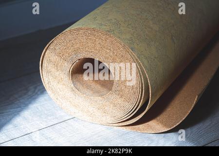 Cork substrate. Natural substrate for laying laminate flooring. Quality product. Renovation in house. Stock Photo