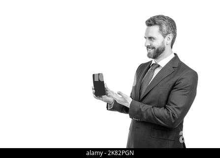 Happy professional man presenting mobile phone with advertising gesture, communication Stock Photo