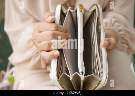 women hand open an empty wallet Stock Photo