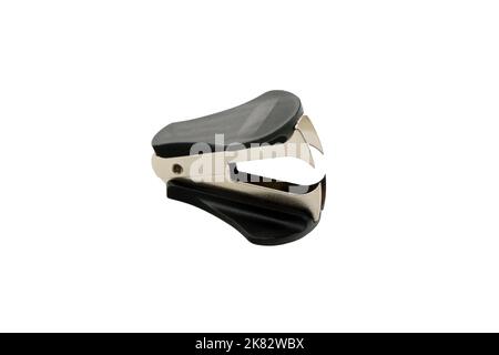 Black anti stapler paper clip or expander isolated on a white background, close up Stock Photo