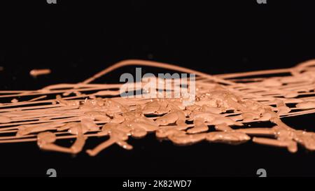 Close up view of blurred makeup concealer on black background Stock Photo