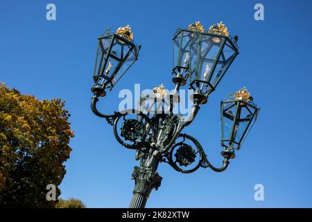 Street lamp with crowns in the park in front of the Royal Palace in Oslo, Norway Stock Photo