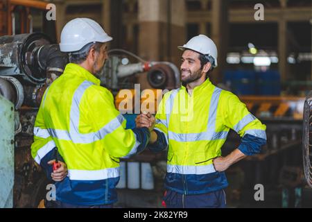industrial factory with men at work concept, professional engineer foreman inspector talking in business occupation job teamwork with team, constructi Stock Photo
