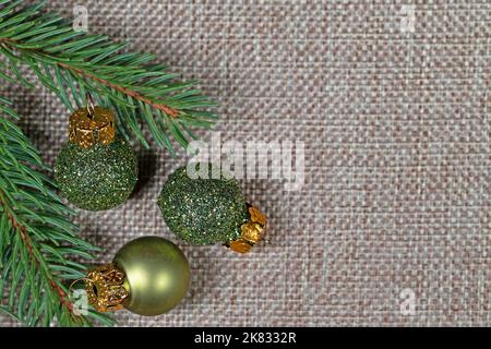 Spruce branch with tree balls on jute fabric Stock Photo