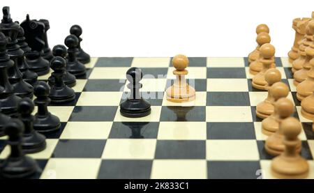 A Man Hand with a Chess Piece in a Board Game. Opening of the Chess Game  with the Move of the White King Pawn E2-e4, Copy Space on Stock Image -  Image