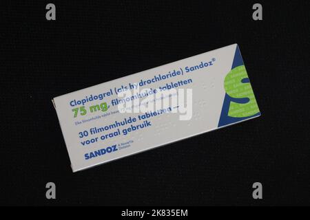 Photo of package of clopidogrel tablets, (an antiplatelet medication, blood thinner) produced by Sandoz, a Novartis division Stock Photo