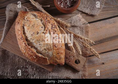 Fresh baked whole grain bread with flax seeds Stock Photo