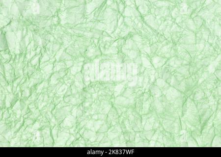 Crumpled paper abstract background texture. Green color. Full frame Stock Photo