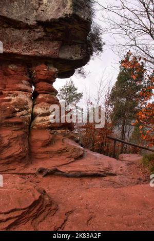Red rocks on base of Devil's Table in the Palatinate Forest of Germany on a winter day. Stock Photo