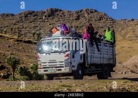 SIMIEN MOUNTAINS, ETHIOPIA - MARCH 17, 2019: Truck carrying local people in Simien mountains, Ethiopia Stock Photo