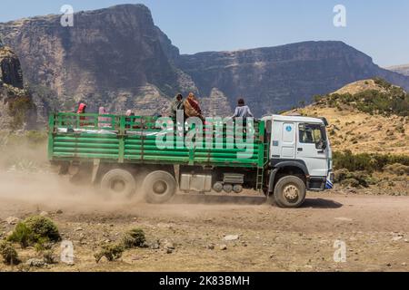 SIMIEN MOUNTAINS, ETHIOPIA - MARCH 17, 2019: Truck carrying local people in Simien mountains, Ethiopia Stock Photo